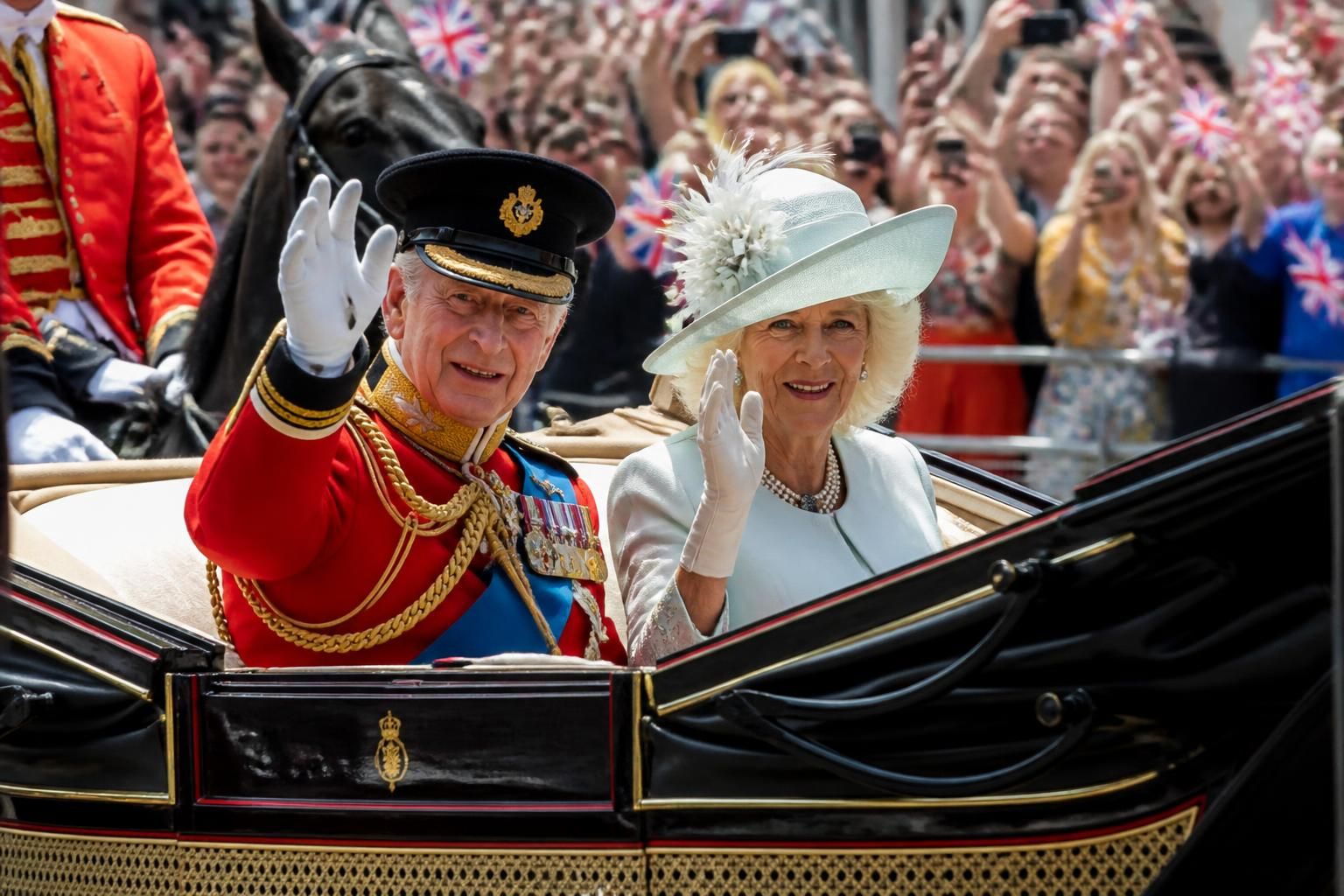 king charles makes a grand entrance at trooping the colour, showcasing royal enthusiasm and tradition in a spectacular procession.