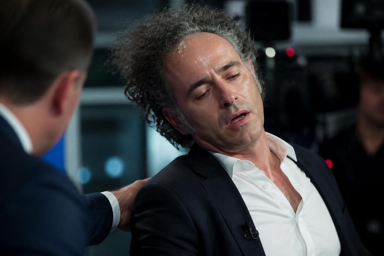 palantir ceo alex karp faints during a rare tv interview, starting to say 'i feel li...' before losing consciousness, sparking concern and curiosity.